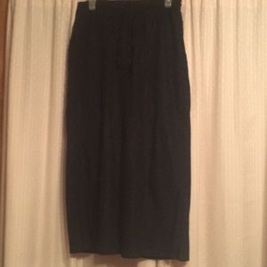 Women within ankle length wide leg pants.